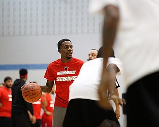 Local promoter Dizzy Hendrix looks to pass the ball during the Rising Stars basketball game at East High School on Sunday. EMILY MATTHEWS | THE VINDICATOR