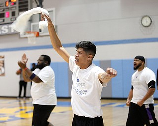 Reggie Wills, Jr. celebrates with his teammates after his team scores during the Rising Stars basketball game at East High School on Sunday. EMILY MATTHEWS | THE VINDICATOR