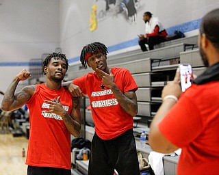 Local artists JonezyTooCool and Craig Jackson, who are part of the group Steez Paradise, get their photo taken by other local music artist Jay King after the Rising Stars basketball game at East High School on Sunday. EMILY MATTHEWS | THE VINDICATOR