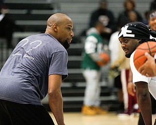 Youngstown alumnus Lonnie Showers, left, and Campbell alumnus Jermain Richardson face-off during the Youngstown vs. Campbell alumni basketball game at East High School on Sunday. EMILY MATTHEWS | THE VINDICATOR