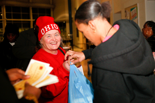 Dorothy Leonard, of Youngstown, receives a turkey at East High School on Monday night. EMILY MATTHEWS | THE VINDICATOR