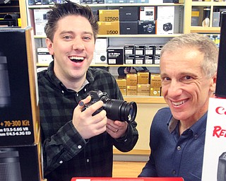 Robby Yankush and his father, Jim Yankush, owner of YM Camera in Boardman, get ready for a busy week of holiday shopping. YM Camera will be offering a variety of deals this week in the run-up to Black Friday.