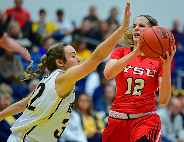 KENT, OHIO - NOVEMBER 20, 2018: Youngstown State's Chelsea Olson puts up a shot while being pressured by Kent State's Hannah Young during the first half of their game, Tuesday night at the Memorial Athletic and Convocation Center. Kent State won 62-34. (David Dermer/Special to the Record Courier)