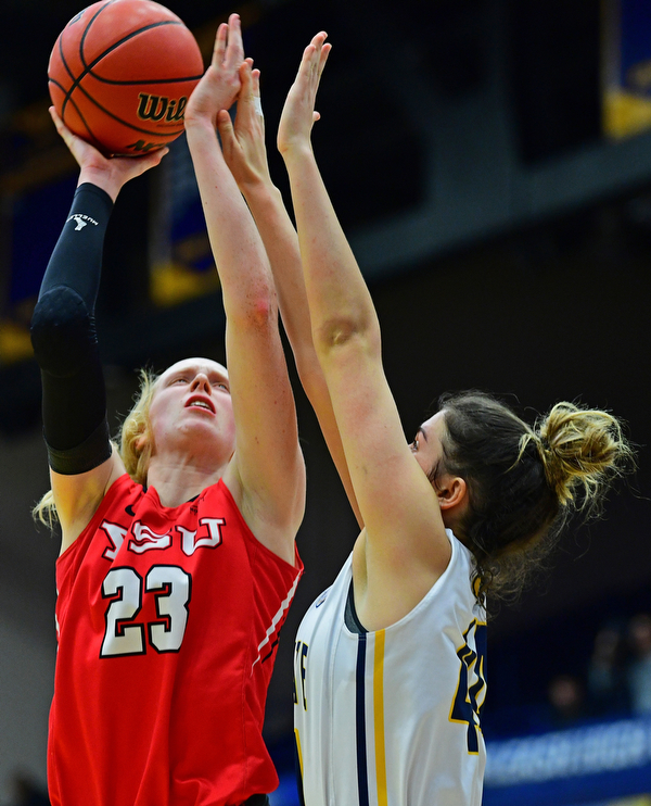 KENT, OHIO - NOVEMBER 20, 2018: Youngstown State's Sarah Cash goes to the basket against Kent State's Lindsey Thall during the second half of their game, Tuesday night at the Memorial Athletic and Convocation Center. Kent State won 62-34. (David Dermer/Special to the Record Courier)