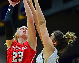 KENT, OHIO - NOVEMBER 20, 2018: Youngstown State's Sarah Cash goes to the basket against Kent State's Lindsey Thall during the second half of their game, Tuesday night at the Memorial Athletic and Convocation Center. Kent State won 62-34. (David Dermer/Special to the Record Courier)