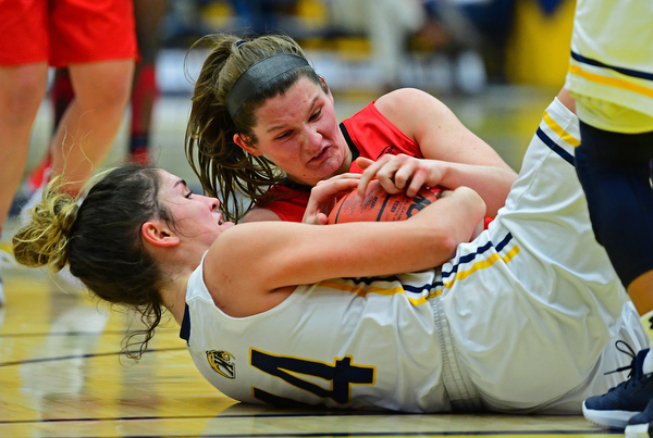 KENT, OHIO - NOVEMBER 20, 2018: Kent State's Lindsey Thall and Youngstown State's Madison Mallory wrestle for the loose ball during the second half of their game, Tuesday night at the Memorial Athletic and Convocation Center. Kent State won 62-34. (David Dermer/Special to the Record Courier)