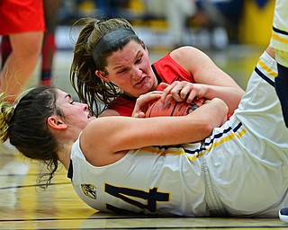 KENT, OHIO - NOVEMBER 20, 2018: Kent State's Lindsey Thall and Youngstown State's Madison Mallory wrestle for the loose ball during the second half of their game, Tuesday night at the Memorial Athletic and Convocation Center. Kent State won 62-34. (David Dermer/Special to the Record Courier)