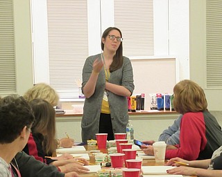 Neighbors | Jessica Harker.Andrea Zupcsan told community members about the project she planned for the Art with Andrea painting class at the Austintown library.