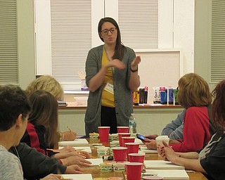 Neighbors | Jessica Harker.Librarian Andrea Zupcsan instructed community members in a simple painting class on Oct. 23 in Austintown.