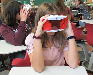 Neighbors | Jessica Harker.Gianna DeNiro used the Google Expedition glasses Oct. 30 in Eric Diefenderfer's science class to better understand the flow of energy in various forms.