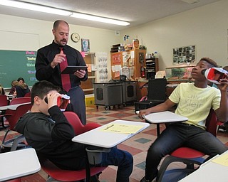 Neighbors | Jessica Harker.Glenwood Junior High teacher Eric Diefenderfer controlled the virtual reality worlds Joul Kozar and Jevarac McNeil were able to see through their Google Expedition glasses on Oct. 30.