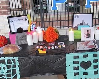 Neighbors | Jessica Harker.The Poland Seminary High School Spanich Club created ofrendas for members of the school community who have died, including Kate Spade, during the club's Trunk or Treat event held Oct. 30.