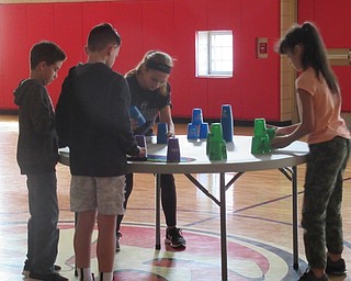 Neighbors | Jessica Harker.Students used stack up cups and timing mats to practice their timing for 3-3-3 stacks during gym class at Austintown Intermediate School on Nov. 7.