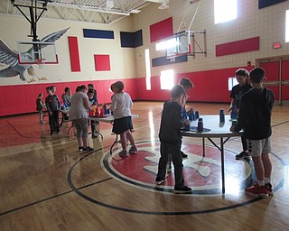 Neighbors | Jessica Harker.Students at Austintown Intermediate School played cup stack during their gym period on Nov. 7.