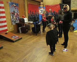 Neighbors | Jessica Harker.Brennan Mitovich played cornhole with his mother, Stacy, at the Boardman Park's annual Mom and Son Date Knight event.