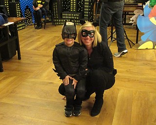 Neighbors | Jessica Harker.Brennan and Stacy Mitovich dressed in matching Batman and Catwoman outfits for the annual Mom and Son Date Knight event hosted by Boardman Park.