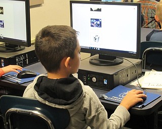 Neighbors | Jessica Harker.Poland Union second-grader Lucas Schuster voted during his computer class for the new fish to be entered into the schools salt water aquarium on Nov. 9.