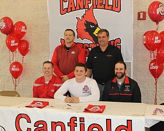 Neighbors | Abby Slanker.Canfield High School senior wrestler Tyler Stein was joined by his wrestling and football coaches as he signed his National Letter of Intent to continue his academic and wrestling career at The Ohio State University on Nov. 14. Pictured are, from left, (front) Dean Conley, Stein, Steve Pitts; (back) Dave Crawford and Mike Pavlansky.