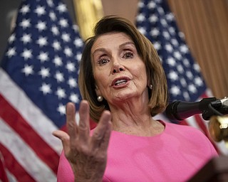In this Nov. 7, 2018, file photo, House Minority Leader Nancy Pelosi, D-Calif., speaks in during a news conference on Capitol Hill in Washington. House Democrats are laying out a vision for their new majority, and one item is noticeably missing from the to-do list: President Donald Trump’s impeachment. They’re making plans for spending on public works projects, lowering health costs and increasing government oversight. It’s the balance that Pelosi is trying to strike. 