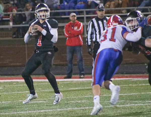 Girard's Mark Waid drops back to pass in Dover on Saturday November 24, 2018. ETHAN CLEWELL | THE VINDICATOR