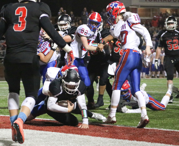 Mark Waid falls into the end zone for a touchdown to take the lead in Dover, Ohio on Saturday Nov. 24, 2018.. ETHAN CLEWELL | THE VINDICATOR