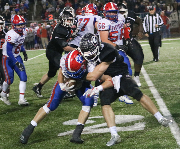 Girard's Nick Malito tackles Licking Valleys Connor McLaughlin in Dover, Ohio on Saturday Nov. 24, 2018. ETHAN CLEWELL | THE VINDICATOR