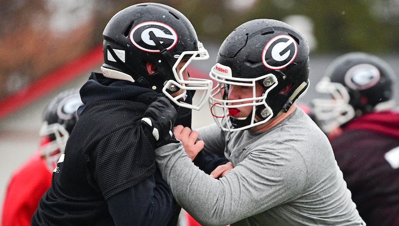 Girard’s Jack DelGarbino, right, blocks Nassim Lloyd during practice Monday at Arrowhead Stadium. DelGarbino, a state wrestling champion, is a two-way lineman for the Indians. Girard will play for a state title against Cincinnati Wyoming on Saturday night.