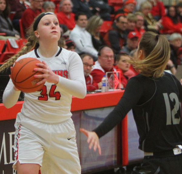 William D. Lewis The Vindicator YSU's McKenah Peters(34) passes around Akron's Shayna Harmon(12).