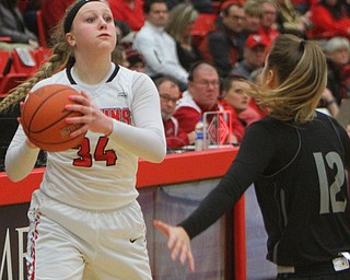 William D. Lewis The Vindicator YSU's McKenah Peters(34) passes around Akron's Shayna Harmon(12).