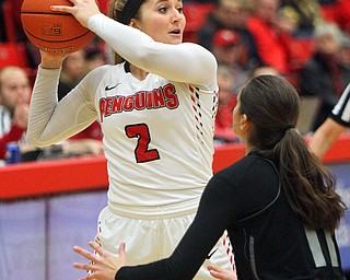 William D. Lewis The Vindicator YSU's Alison Smolinski(2) passes around Akron's Megan Sefcik(11).