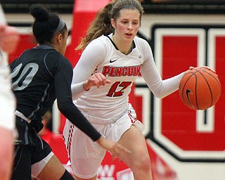 William D. Lewis The Vindicator YSU's Chelsea Olson(12) drives around Akron's Gabrielle Brown-Mitchell(20).