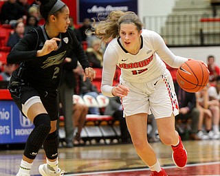 William D. Lewis The Vindicator YSU's Chelsea Olson(12) drives around Akron's Gabrielle Brown-Mitchell(20).