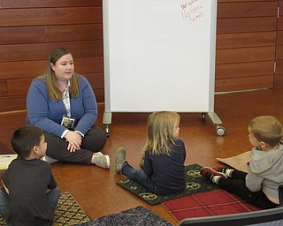 Neighbors | Jessica Harker.Amelia Dale, a librarian assistant, sung songs with children and read books to them during the first Read and Make event at the Michael Kusalaba library.