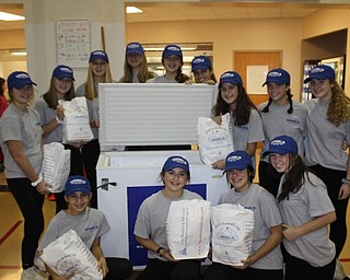 Neighbors | Abby Slanker.On Oct. 31, a group of Canfield Village Middle School eighth-graders dressed as Handel’s employees and passed out ice cream sandwiches during the school’s annual Halloween Dress Up Day.