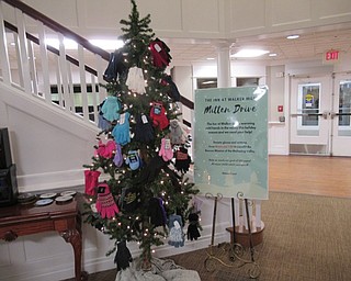 Neighbors | Jessica Harker.Residents of the Inn at Walker Way in Boardman decorated a tree with donated mittens for the Rescue Mission.