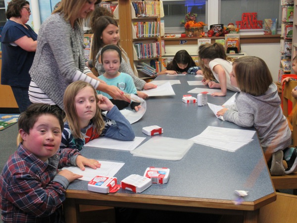 Neighbors | Jessica Harker.Students ages 3-15 gathered at Poland Union Elementary to fill buckets with safety supplies for all of the class rooms at the school on Nov. 12.