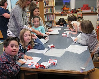 Neighbors | Jessica Harker.Students ages 3-15 gathered at Poland Union Elementary to fill buckets with safety supplies for all of the class rooms at the school on Nov. 12.