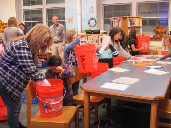 Neighbors | Jessica Harker.Poland members of the Boo Squad filled buckets with safety equiptment Nov. 12 at Poland Union Elementary School.