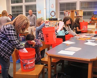 Neighbors | Jessica Harker.Poland members of the Boo Squad filled buckets with safety equiptment Nov. 12 at Poland Union Elementary School.