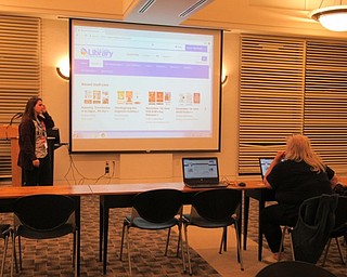 Neighbors | Jessica Harker.Community members gathered at the Austintown library Nov. 12 to learn how to get the most out of the new library system.
