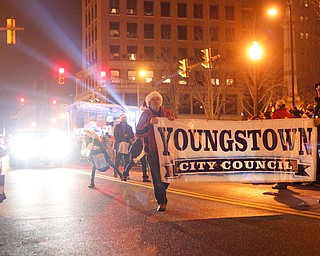 The Youngstown City Council marches in Youngstown's annual Holiday Parade on Friday night. EMILY MATTHEWS | THE VINDICATOR