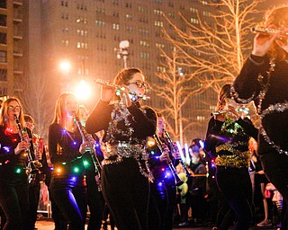 Members of the Lakeview High School Marching Band perform while wrapped in garland and Christmas lights during Youngstown's annual Holiday Parade on Friday night. EMILY MATTHEWS | THE VINDICATOR