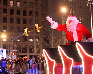 Santa waves to the crowd during Youngstown's annual Holiday Parade on Friday night. EMILY MATTHEWS | EMILY MATTHEWS