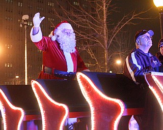 Santa waves to the crowd during Youngstown's annual Holiday Parade on Friday night. EMILY MATTHEWS | EMILY MATTHEWS