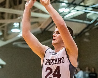 DIANNA OATRIDGE | THE VINDICATOR  Boardman's Charlie Davis shoots a three pointer during their game against Youngstown East at Boardman High School Friday night.