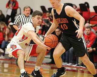 Austin O'Hara (33) of Girard steals the ball from Howland's Nathan Barrett (40) during Friday nights matchup at Girard High School.  Dustin Livesay  |  The Vindicator  11/30/18  Girard