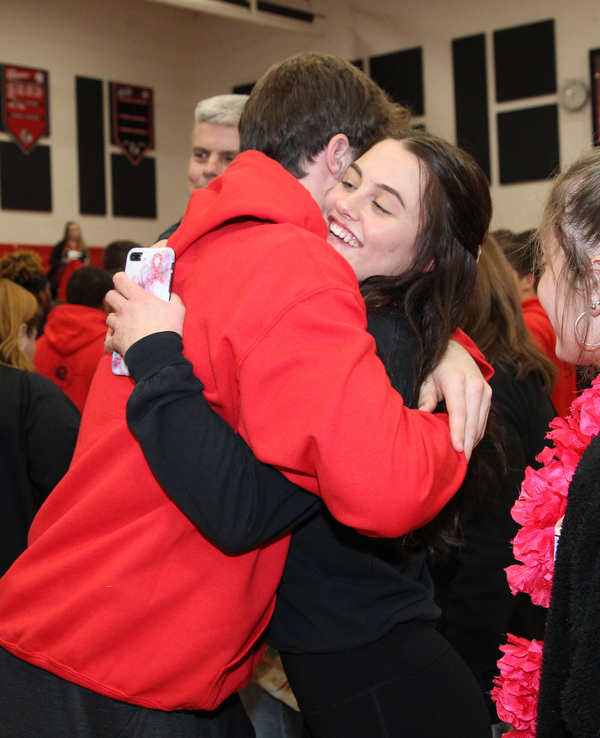 Girard junior, Lindsay Cave, hugs Nick Malito before he left with the football team to compete in the state championship football game in Canton Saturday night.  Dustin Livesay  |  The Vindicator  11/30/18  Girard