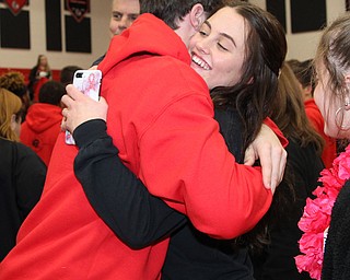 Girard junior, Lindsay Cave, hugs Nick Malito before he left with the football team to compete in the state championship football game in Canton Saturday night.  Dustin Livesay  |  The Vindicator  11/30/18  Girard