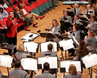 The Packard Band, led by Dr. Stephen L. Gage, perform Country Cookin' Christmas during their annual Christmas Spectacular at W.D. Packard Music Hall on Sunday afternoon. EMILY MATTHEWS | THE VINDICATOR