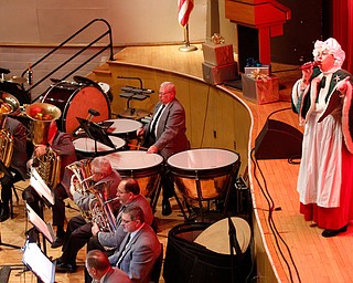 Mrs. Claus sings Jingle Bells during The Packard Band annual Christmas Spectacular at W.D. Packard Music Hall on Sunday afternoon. EMILY MATTHEWS | THE VINDICATOR